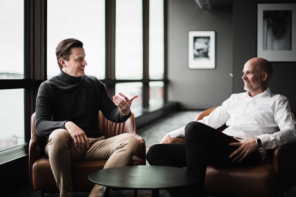The founders of Elastx sits in chairs looking happy